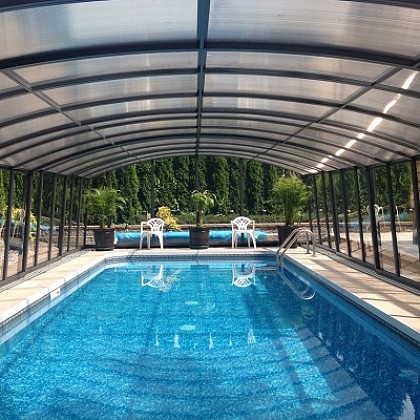 What materials are used for Albixon pool enclosures?
